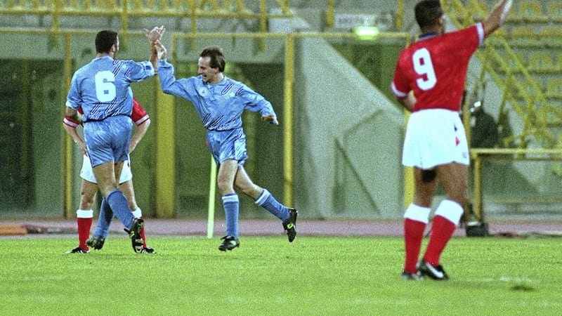 San Marino&#39;s Davide Gualtieri (centre) is congratulated by team mate Guerra after scoring against England during the world cup qualifier in Bologna in November 1993 
