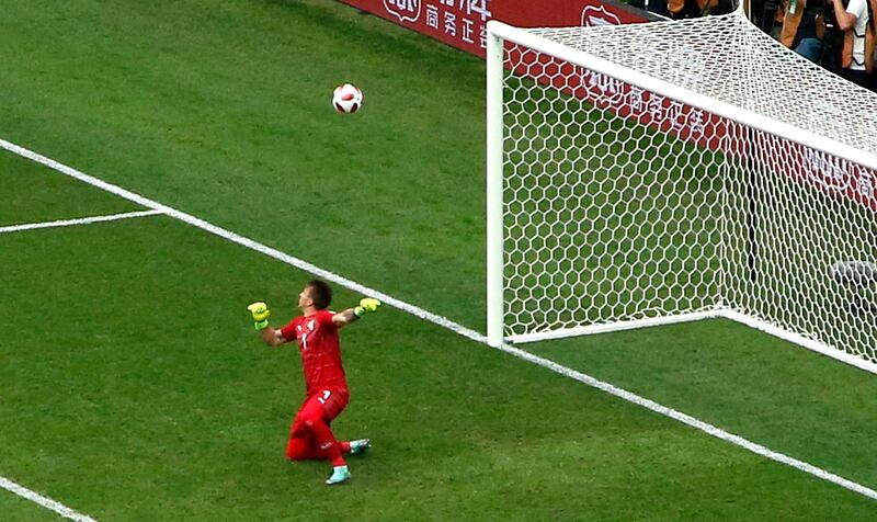 Muslera watches the ball fly into his net