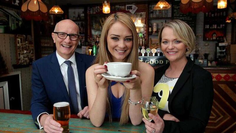 Hospitality Ulster chief executive Colin Neill and chair Olga Walls with model Ashleigh Coyle as the Pub of the Year shortlist is unveiled