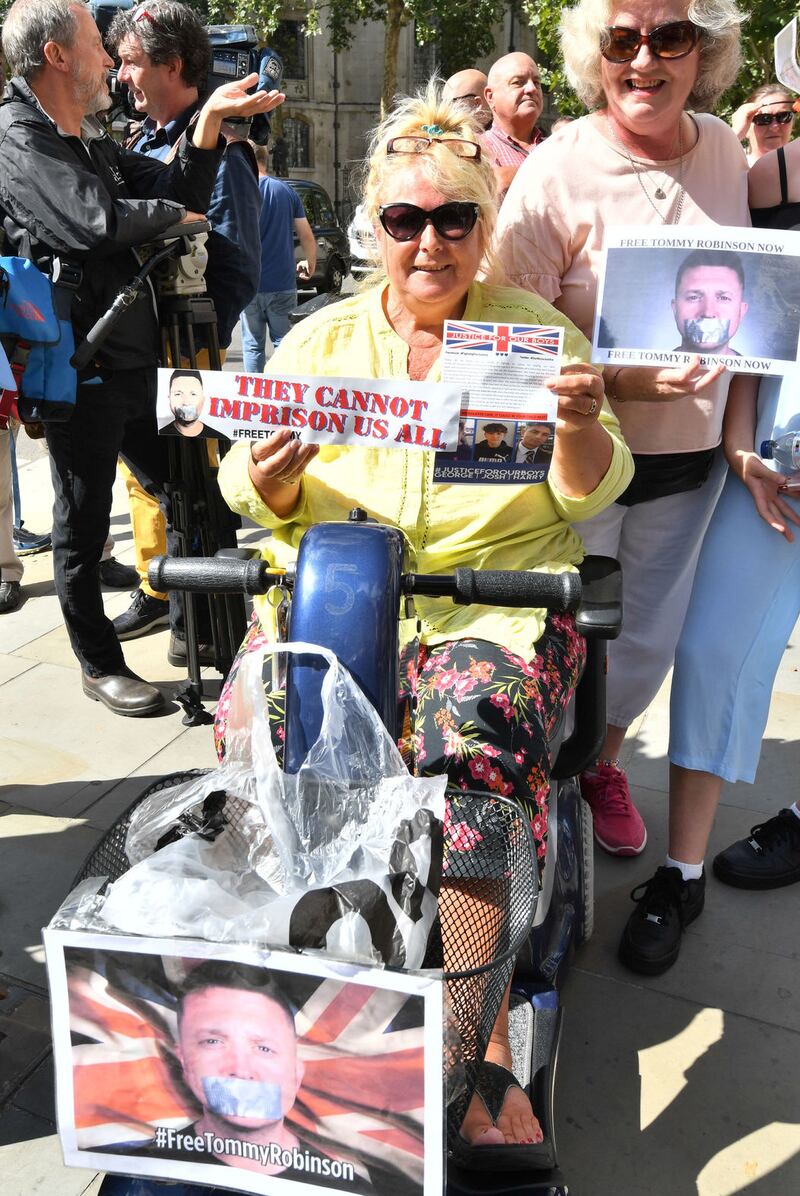 Supporters of Tommy Robinson celebrate outside the Royal Courts of Justice in London&nbsp;