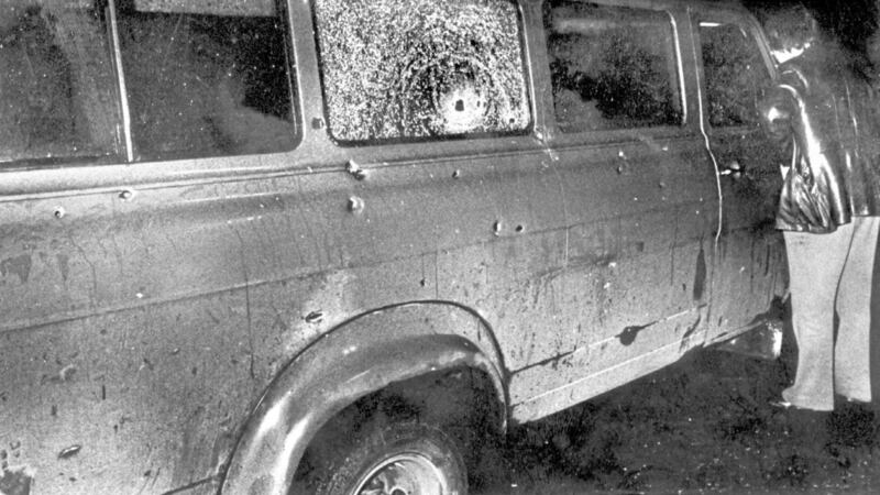 The bullet-riddled minibus at the scene of the massacre of 10 Protestant workman shot dead by the IRA at Kingsmill, South Armagh, in January 1976. 