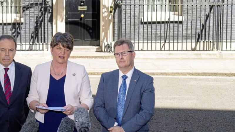 DUP leader Arlene Foster, DUP deputy leader Nigel Dodds (left) and MP Sir Jeffrey Donaldson outside 10 Downing Street in London after the party agreed a deal with the Conservative Party  