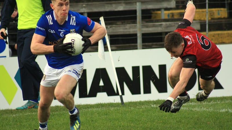 Cavan's Dara McVeety gets away from Down's Ceilum Doherty during Sunday's Allianz Football League Division Three match at Kingspan Breffni     Picture: Ian McCabe