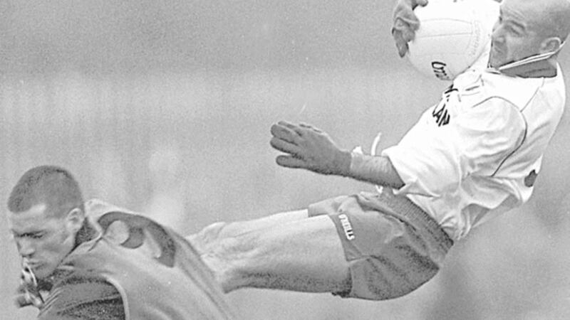 ACROBATICS...Tyrone&rsquo;s Paul Donnelly and Down&rsquo;s Greg McCartan take to the air in yesterday&rsquo;s Ulster Senior football clash at Clones 