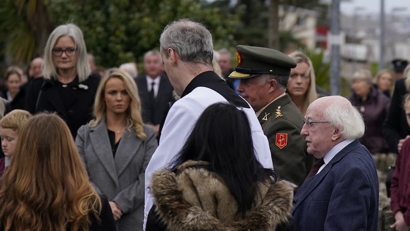 Irish President Michael D. Higgins (right) arrives for the funeral mass of James O'Flaherty at St Mary's Church, Derrybeg. James died following an explosion at Applegreen service station