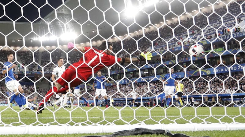 Germany's Mesut Ozil, second left, scores the opening goal past Italy goalkeeper Gianluigi Buffon&nbsp;