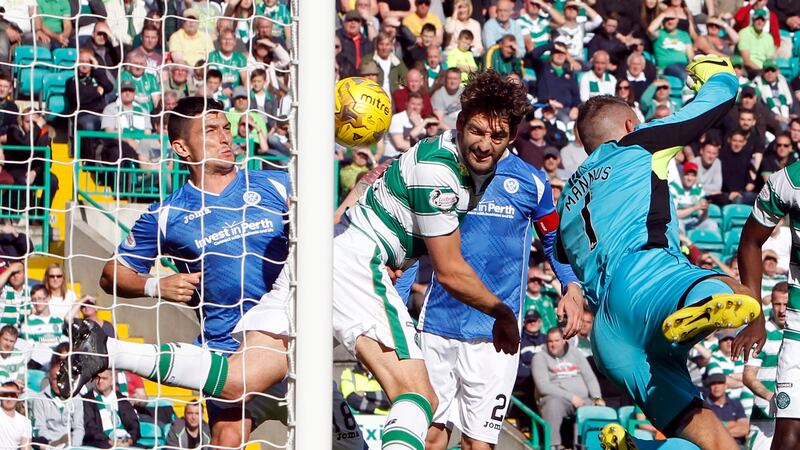 Charlie Mulgrew heads in Celtic's third goal against St Johnstone at Celtic Park on Saturday<br />Picture: PA