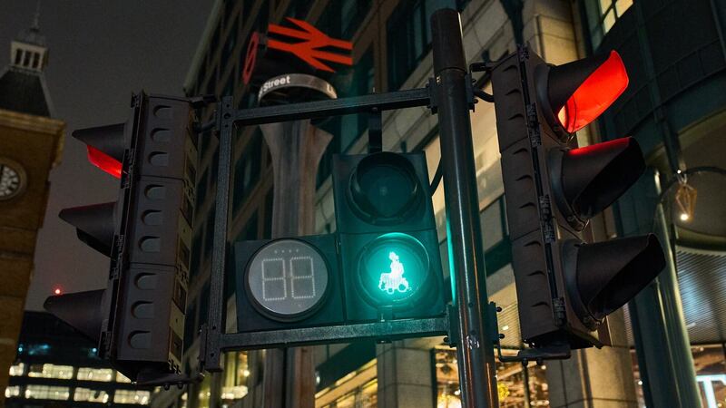 New green wheelchair user traffic light signals have been installed at road crossings in London to raise awareness of the capital’s disabled population (TfL/PA)