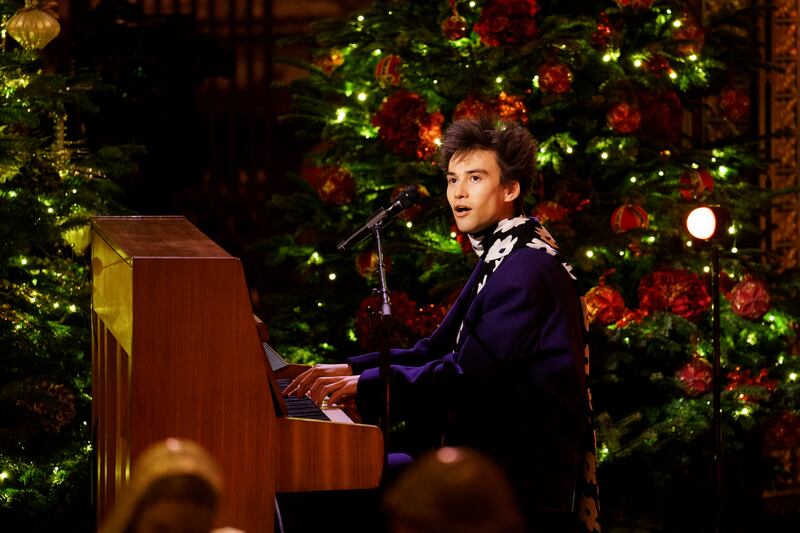 Jacob Collier performs during the Royal Carols – Together At Christmas service at Westminster Abbey on John Lennon’s former piano. Jordan Pettitt/PA Wire