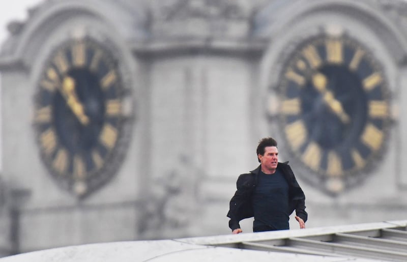 Tom Cruise runs along the rooftop of Blackfriars station in London (John Stillwell/PA)