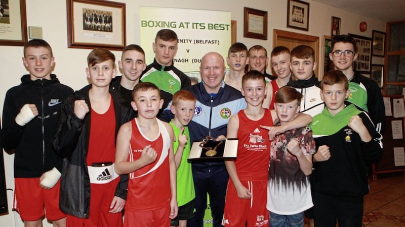 The only Irishman ever to win a boxing gold medal at the Olympics, Michael Carruth, was in Belfast last week when he brought a team from his Drimnagh club to face Holy Trinity. He was joined by brothers William and Martin, and showed off his medal &ndash; won at the 1992 Games in Barcelona &ndash; to all the young fighters. Carruth also renewed acquaintances with Michael Hawkins, who was one of the Irish coaches at his first Olympics in 1988. Picture by Matt Bohill 