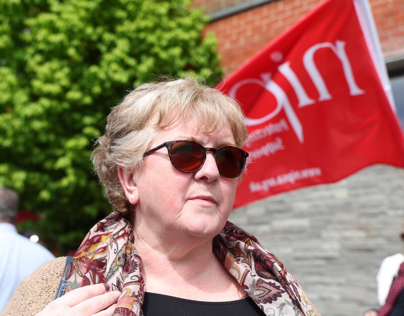 Social Worker Clare Joudeh stands with Nipsa members on strike at the Shankill Wellbeing and Treatment Centre. PICTURE: MAL MCCANN