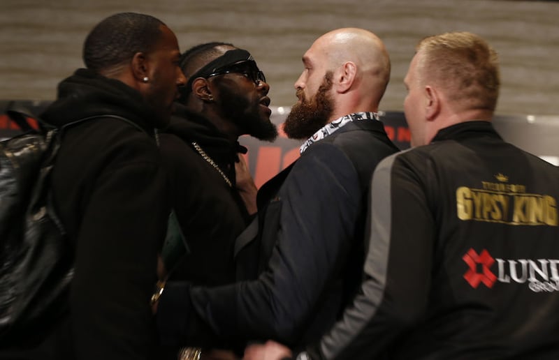 Boxers Deontay Wilder (left) and Tyson Fury square up as things got hot at a news conference in Los Angeles ahead of  this Saturday night for Wilder's WBC heavyweight title.