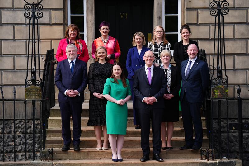 First Minister John Swinney stands with his newly appointed Cabinet on the steps of Bute House
