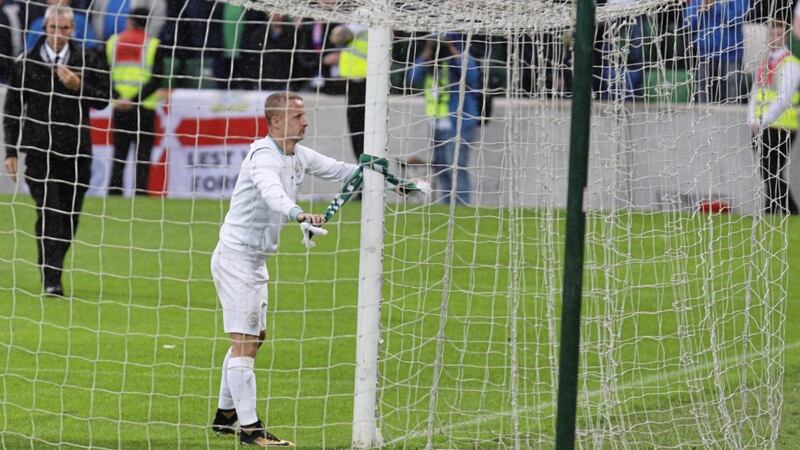 Leigh Griffiths ties a Celtic scarf around the post at Windsor Park, an act which has earned him a one-match European ban Picture by Matt Bohill 