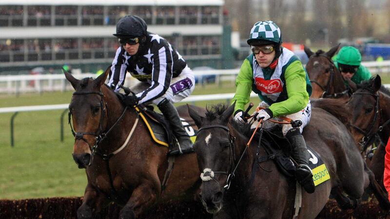 Gold Cup winner Imperial Commander (7/1) (left), ridden by Paddy Brennan, keeps focused as second-placed Denman (4/1), with Tony McCoy on board, challenges during the Cheltenham Gold Cup on Friday March 19 2010