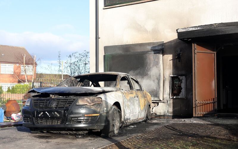 The car was reversed towards the house, then set alight. Picture by Mark Marlow 