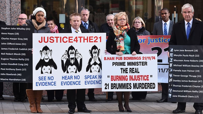 Julie Hambleton (centre), who leads the Justice4the21 campaign and whose sister Maxine died in the Birmingham pub bombings, with other bereaved families outside the city's civil justice centre. Picture by&nbsp;Joe Giddens, PA Wire