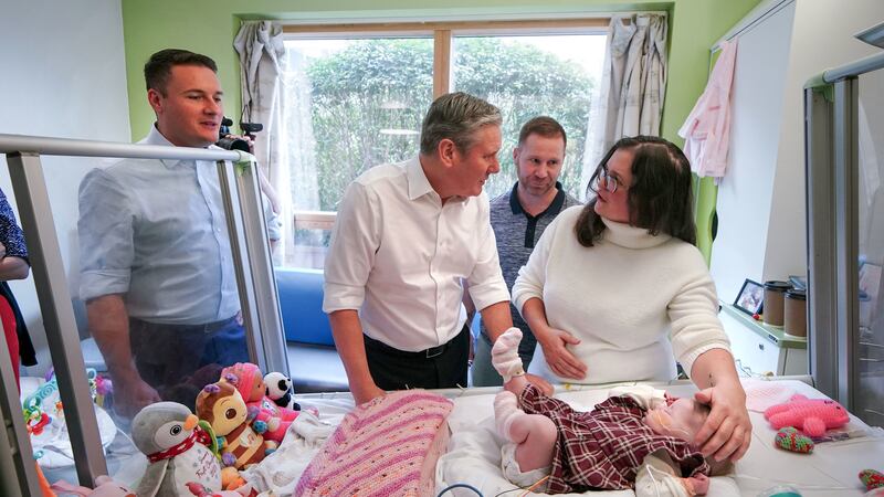 Sir Keir Starmer and shadow health secretary Wes Streeting meet Michael and Kelly with their daughter during a visit to Alder Hey Children’s Hospital, Liverpool as the Labour leader pledges to prioritise children on NHS waiting lists should Labour come to power at the next general election