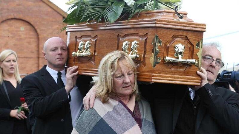 Seamus Wright's sister Breige at her brother's funeral in west Belfast. Picture by Hugh Russell