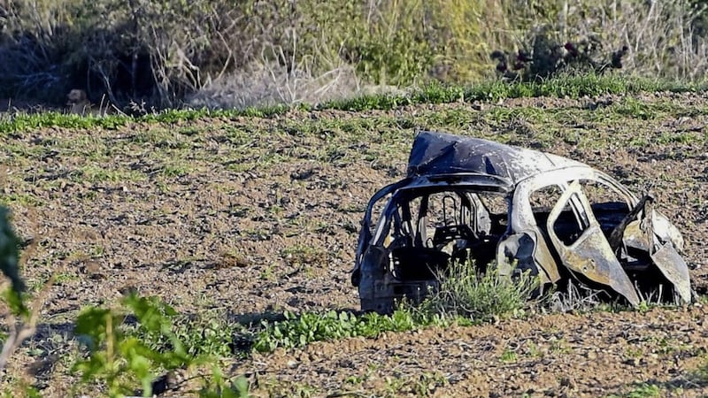 The wreckage of the car of investigative journalist Daphne Caruana Galizia lies next to a road in the town of Mosta, Malta PICTURE: Rene Rossignaud/AP 