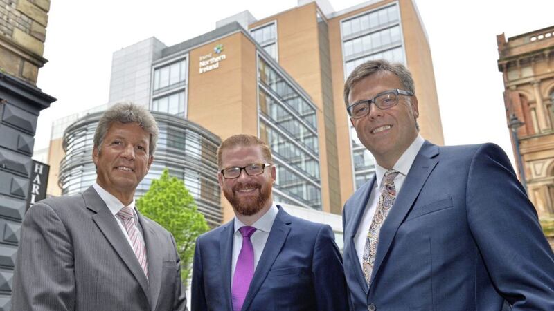 GOING GOING GONE: Invest NI&#39;s departing chairman Mark Ennis (left) and chief executive Alastair Hamilton (right) with former Stormont economy minister Simon Hamilton, who is no longer in his post 