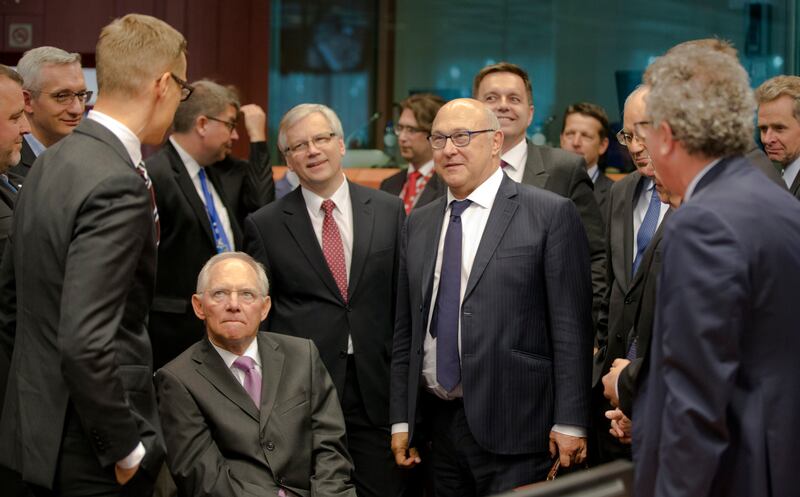 German finance minister Wolfgang Schaeuble, centre left, during a meeting of eurogroup finance ministers in Brussels in 2015 (Thierry Monasse/AP)
