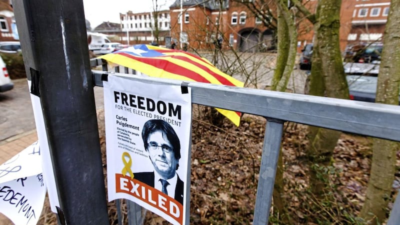 A poster featuring former Catalan leader Carles Puigdemont is fixed at the gate to the entrance building of a prison in Neumuenster, northern Germany. Picture by Frank Molter, dpa via Associated Press. 