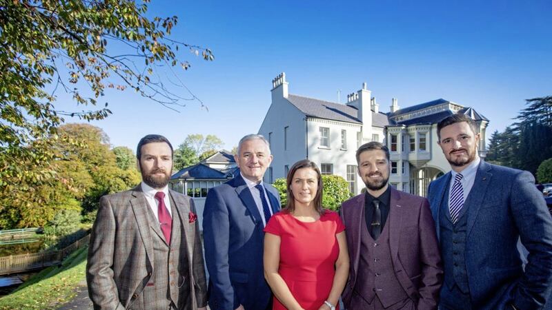 Adam Kemp, Barry Kemp and Sam Harding from The House Hospitality Collection are pictured with Julie McIlwaine and Stephen Comer (centre), business acquisitions managers at First Trust Bank 