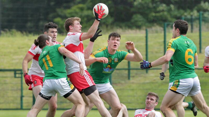 Derry's Brendan Rogers with Cillian O'Sullivan and Harry Rooney of Meath during the round 2 qualifier at Owenbeg on Saturday<br />Picture by Margaret McLaughlin