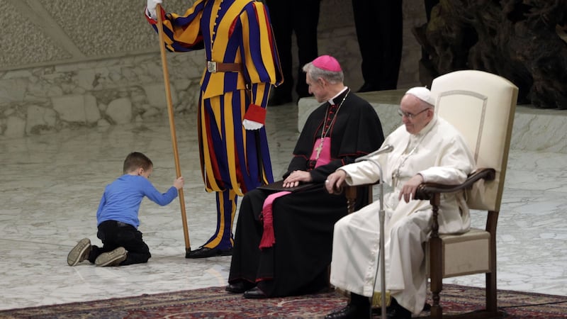 Pope Francis let the boy continue after being told he has behavioural problems and cannot speak.