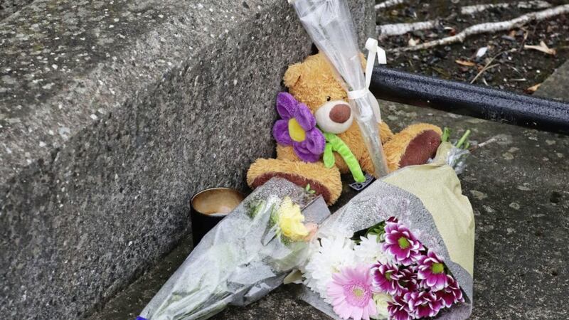 Floral tributes left outside an apartment complex in Kimmage, Dublin, where a three-year-old boy was found dead following a stabbing. Picture by Niall Carson, Press Association 