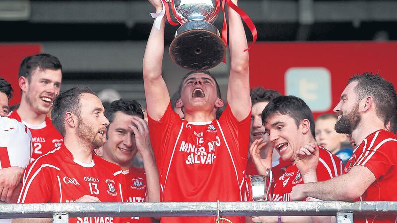 THE WAITING IS OVER: Daire Gallagher hoists the O&rsquo;Neill Cup aloft after Trillick&rsquo;s one-point victory over Killyclogher in the Tyrone county final. It was the club&rsquo;s first senior championship success in 29 years and 15 of the players involved this season have followed in the footsteps of their fathers, who won county medals during the glory days of the 1970s and &lsquo;80s&nbsp;Picture: Seamus Loughran