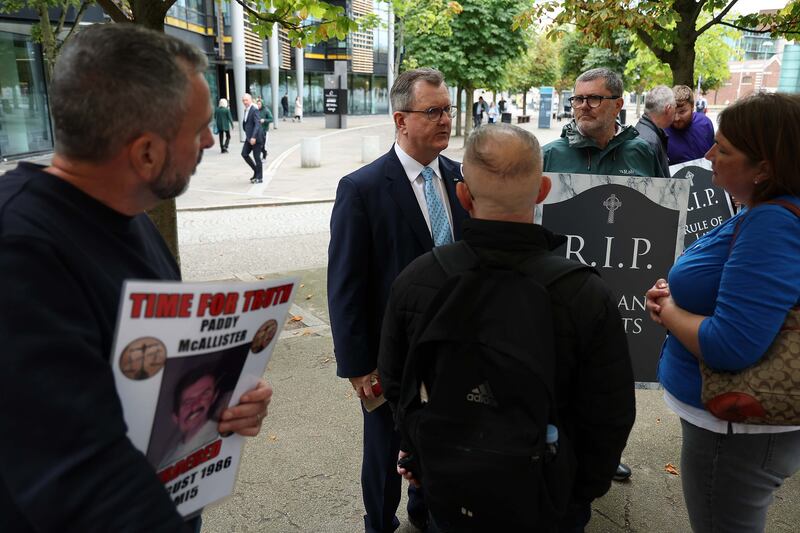 DUP leader Jeffery Donaldson stops to speak with victims campaigners at they protest against the Legacy Bill. Picture Mal McCann