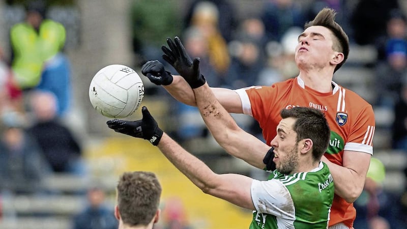 Fermanagh&#39;s Ryan Jones and Armagh&#39;s Ben Crealey compete for possession. Picture by Trevor Lucy. 