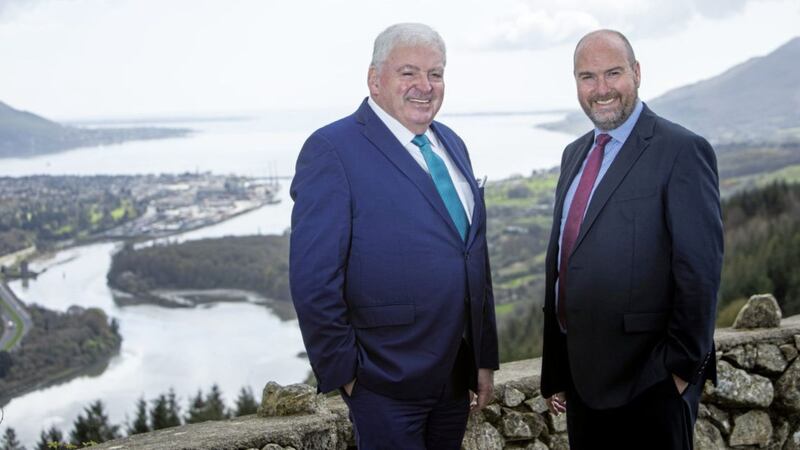Announcing the merger are Feargal McCormack (left), managing director of FPM, and Graeme Allan, chief executive of AAB Group. Picture: Darryl Mooney 