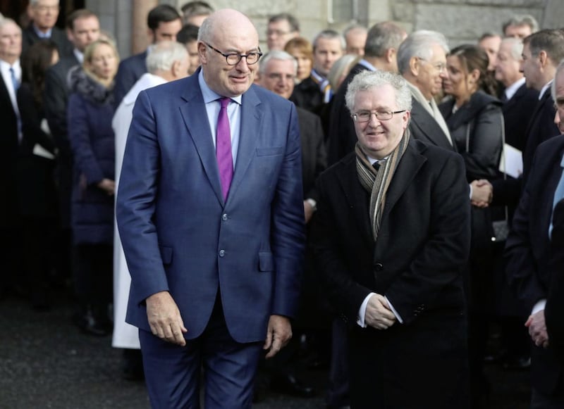 Phil Hogan (left) and Seamus Woulfe pay their respects. Picture by Niall Carson, Press Association 