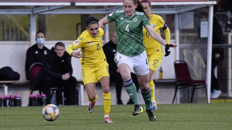 Sarah McFadden hunting down a Ukraine player in the second leg of the play-off for the Euros. 