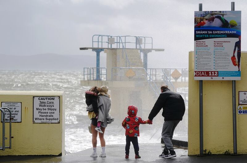 People watch the waves at Blackrock Diving Board, Salthill, Co Galway