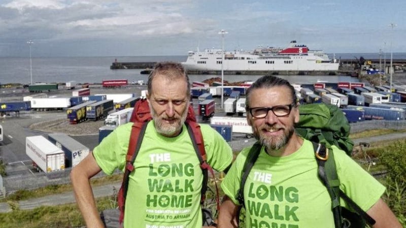 Eamonn Donnelly joins Sepp Tieber-Kessler to celebrate their arrival in Rosslare, Co Wexford following &lsquo; The Long Walk Home&rsquo; 