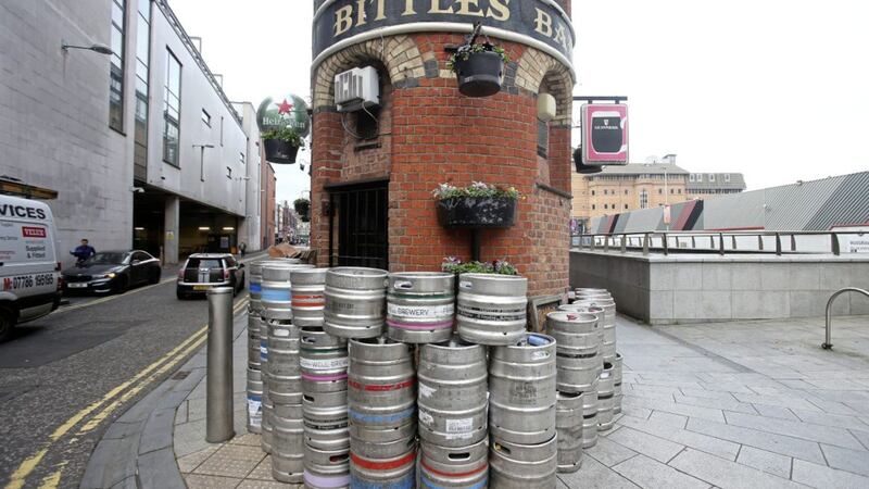 Kegs stacked outside Bittles Bar in Belfast. Hospitality premises were forced to close their doors for four weeks on October 16. Picture by Mal McCann. 