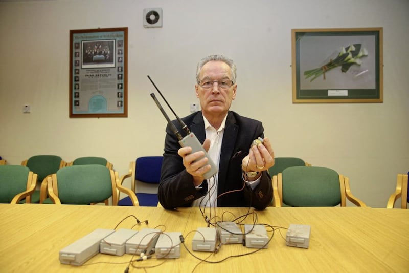 SInn Fein's Gerry Kelly displays a covert listening device found in the former home of Brian Keenan. Picture Mal McCann