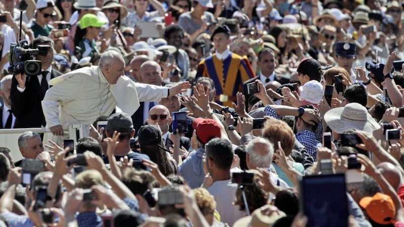 Pope Francis - pictured greeting crowds in St Peter&#39;s Square at the Vatican - is exciting interest among the faithful ahead of his trip to Ireland. But what will those indifferent to the Church make of his visit? Picture by AP Photo/Alessandra Tarantino 