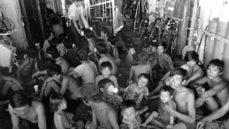 <span style="background-color: rgb(248, 249, 250); color: rgb(84, 89, 93); font-family: sans-serif; font-size: 15.2px;">Vietnamese refugees rest as crewmen aboard the USS FOX give them something to drink.Around 800,000 people are believed to have fled Vietnam in the aftermath of the Vietnam War.</span>