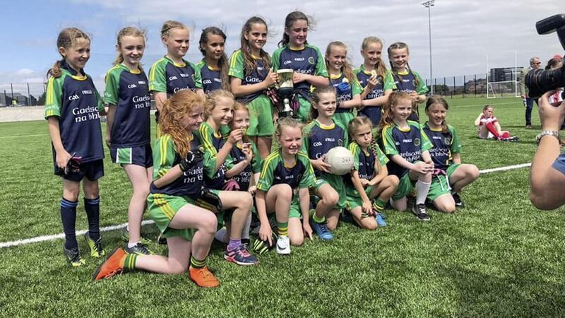 The Gaelscoil na bhF&aacute;l team that defeated St Kieran&#39;s on Tuesday at Col&aacute;iste Feirste to win the County Antrim Cumann na mBunscol Girls&#39; B football championship title. Four players from Gort na Mona GAC - R&oacute;ise Elliott, Hannah Masterson, Seana Bradley and Fianna Fryers - were part of the team and are pictured with their winners&#39; medals 