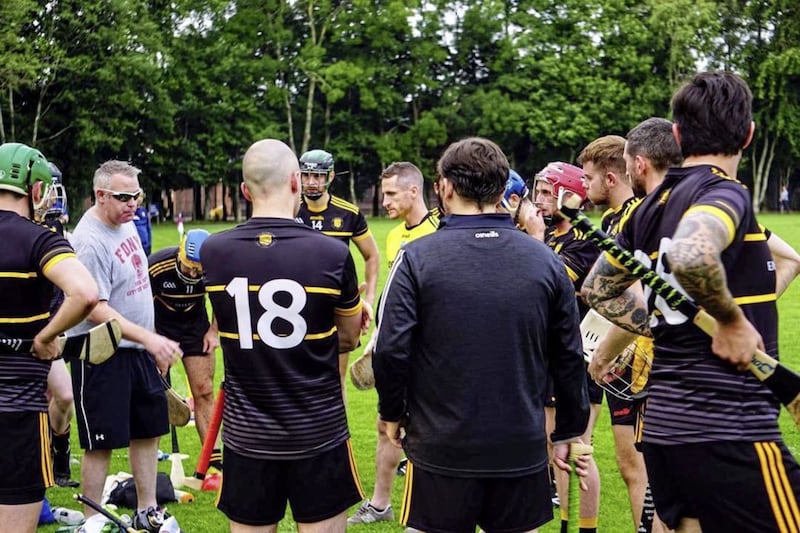 Brian McGuigan (grey T-shirt) and Andrew Breslin (centre, yellow jersey) have enjoyed a fruitful year with the hurlers Picture courtesy of Manso Photography
