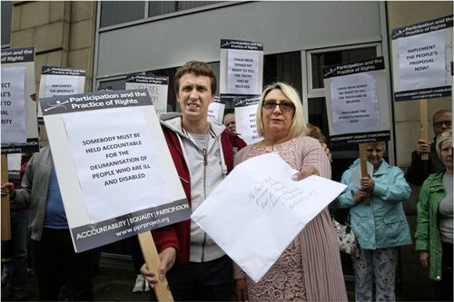 Mum protests at department's Belfast offices over benefits decision 