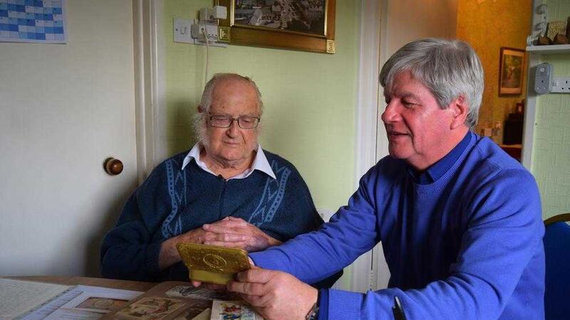 Tom Edgar (left) with Joe Mahon during filming in his cottage in Castlewellan in March                                   