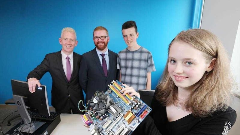 IT CAMP: Economy Minister Simon Hamilton and Novosco Managing Director Patrick McAliskey talk IT with Nendrum College students Lauren McAslan and Nathan McBride at the Novosco Cloud Camp in association with Almac hosted by Belfast Metropolitan College. 
