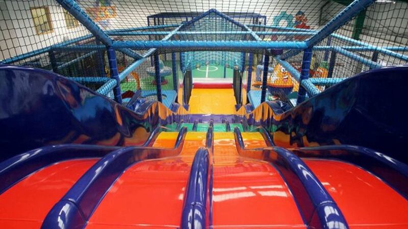 image taken from the top of a series of slides inside a soft play centre.